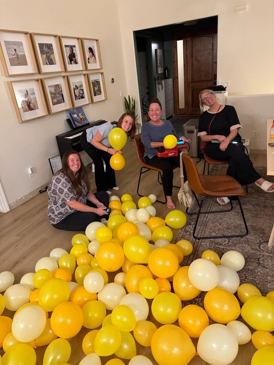 Channing Hall PTO volunteers preparing a balloon arch